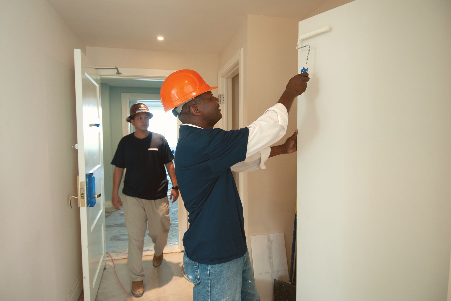 Tradespeople fitting out a room