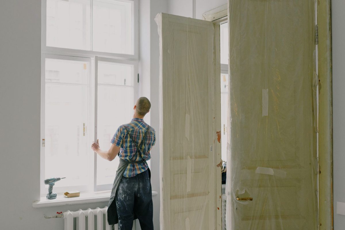 A tradesperson fitting out a room during a renovation